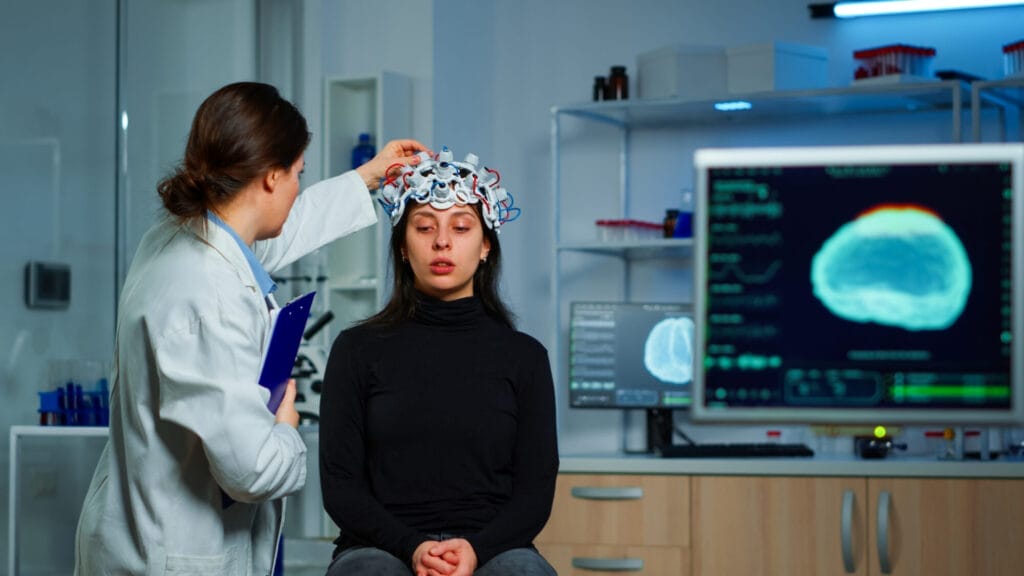 a neurologist conducting a neurological exam to a patient