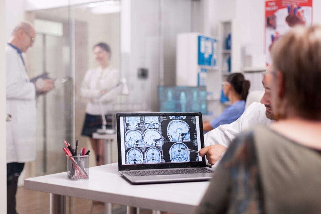 a doctor explaining a neurological exam result to a patient